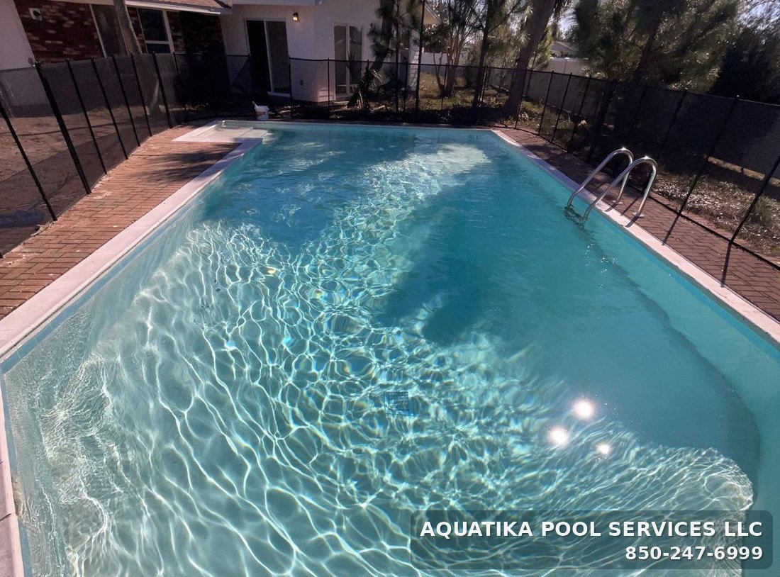 Inground pool in Panama City kept clear under weekly maintenance by Aquatika Pool Services